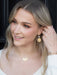 Side view of the radiant Danica Earrings, showcasing their 18K gold-plated brilliance that could make even a supernova jealous!