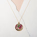 Elegant presentation of the Garden Variety Flower Confetti Gold Moon Necklace on an 18" gold filled chain.