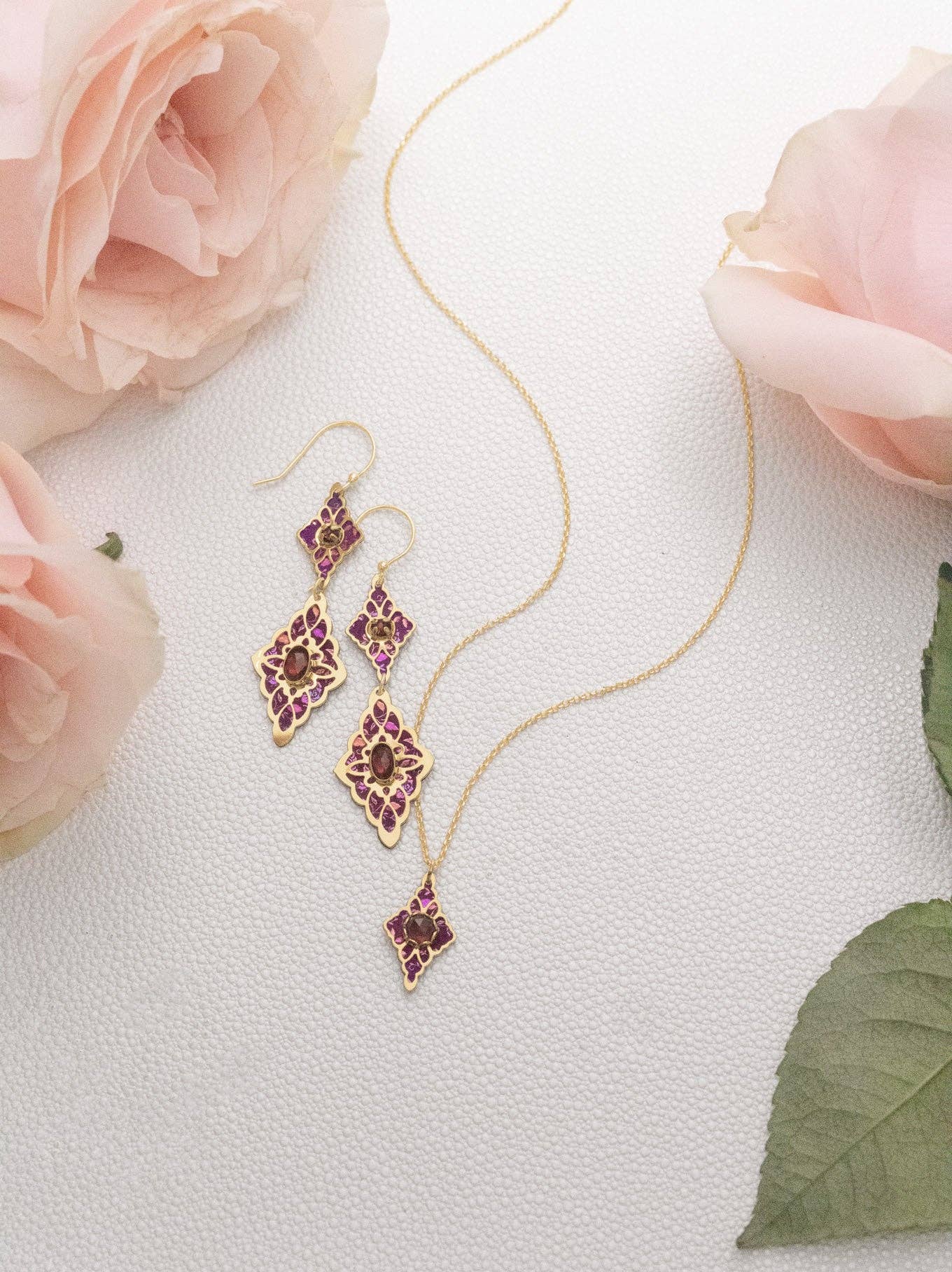 Close-up of Esmeralda Earrings showcasing the intricate niobium florals and faceted stones – for those who enjoy a little bling with their boisterous statements!