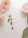 Close-up of Esmeralda Earrings showcasing the intricate niobium florals and faceted stones – for those who enjoy a little bling with their boisterous statements!