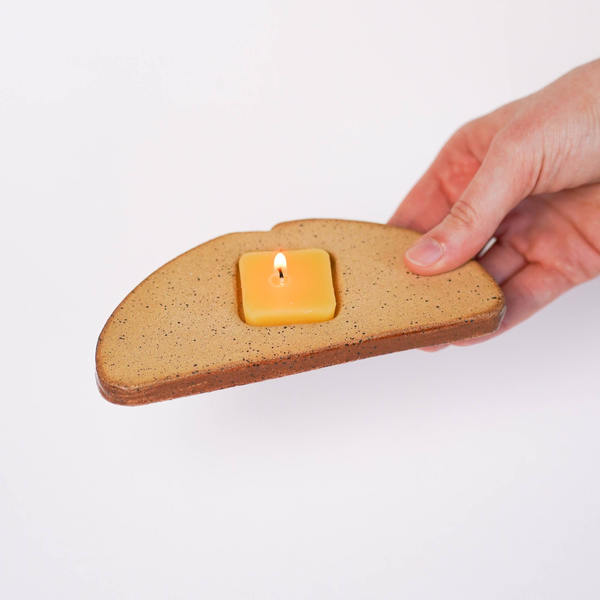 ceramic toast with butter candle