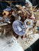 ghost wooden pin surrounded by dried flowers