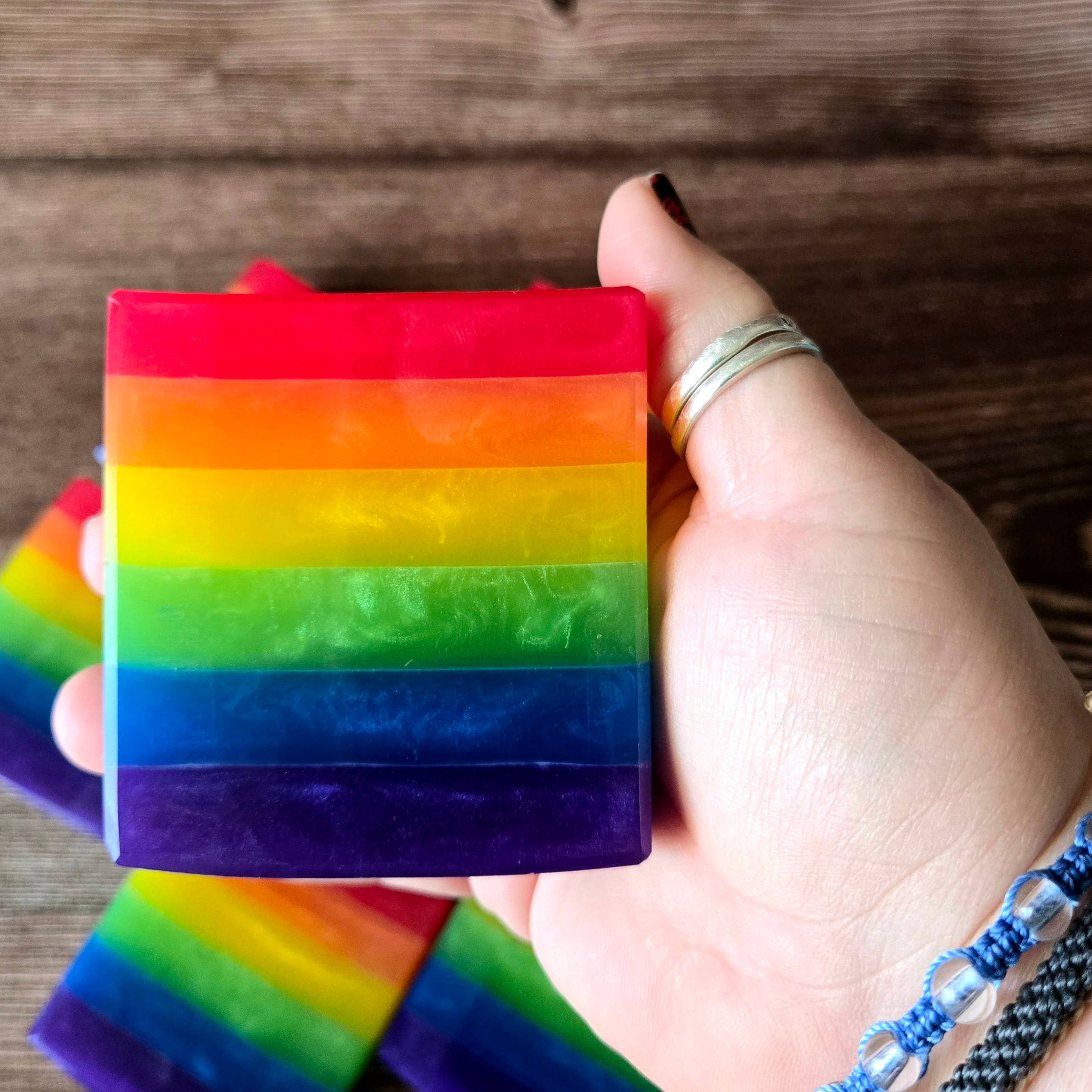 Handcrafted Rainbow Pride Soap by Pretty Soap Co., depicting its colorful layers and vegan-friendly ingredients for a joyful shower experience.