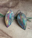 Botanical Large Leaf Fire Painted Copper Earrings beautifully hand-crafted with unique colors from the heat of the torch, showcasing their 2 1/4 inch long design and lightweight feel.