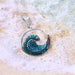 Close-up view of the Free Wave Pendant from Mosaico Jewels, featuring intricate details of the crystal and silver that embody elegance and untamed spirit.