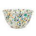Large Salad Bowl in Desert Rose pattern by Crow Canyon Home. This enamelware bowl features a vibrant design with a mix of blue, yellow, and green splashes on a white background, ideal for serving salads.