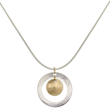 Contemporary ring with cymbal necklace by Marjorie Baer, featuring a hammered silver ring and a brass cymbal on a silver link chain.