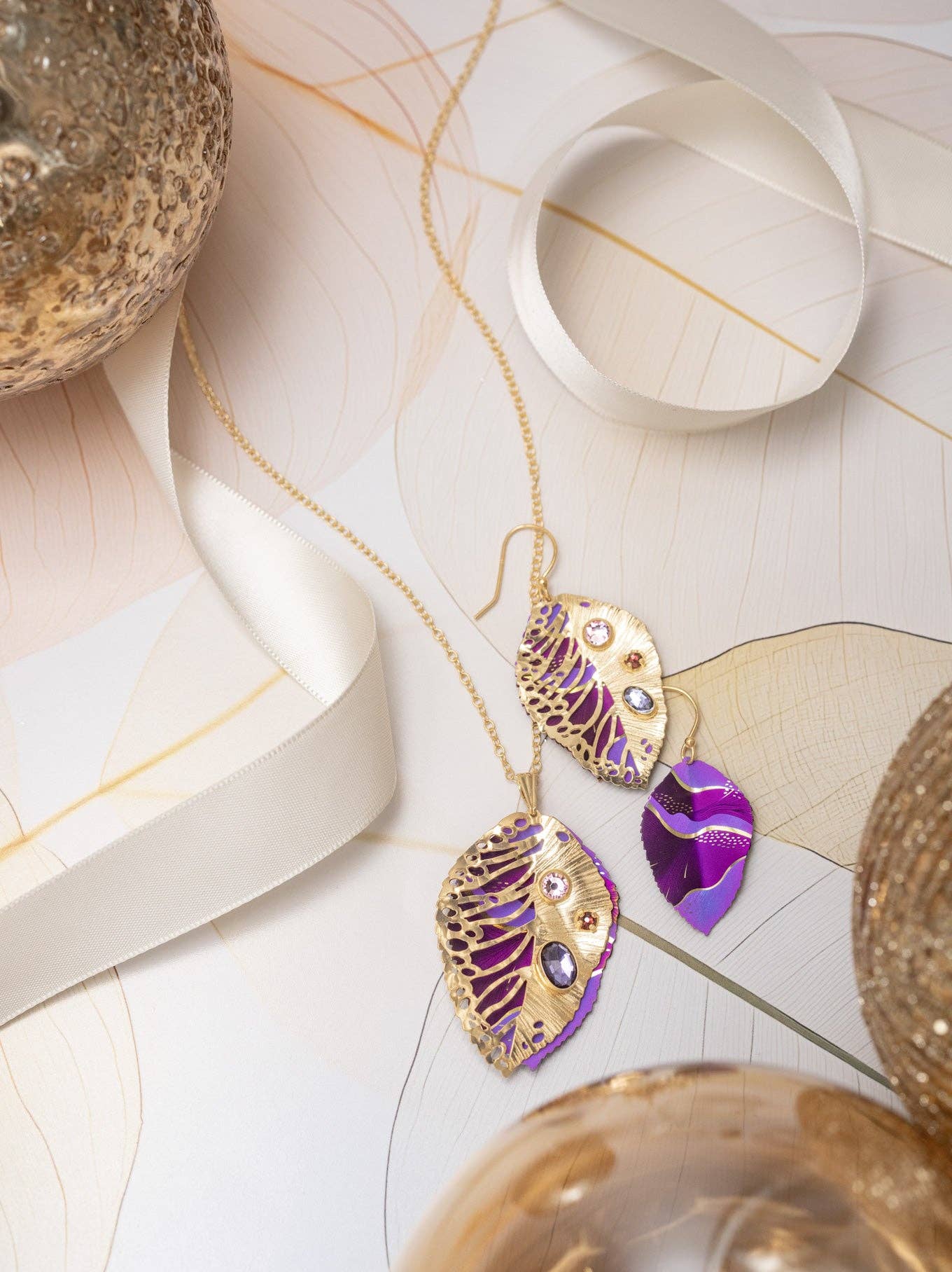 Lifestyle image featuring Eccentric Elm Earrings by Holly Yashi, making a statement at a casual brunch; because even your earrings deserve to enjoy a mimosa!