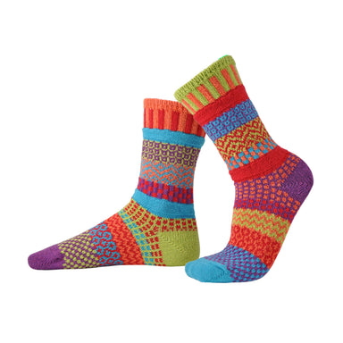 Cosmos Crew Socks by Solmate Socks featuring vibrant colors of purple, lime green, red, orange, and turquoise in a joyful design.