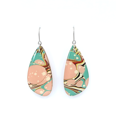 Detailed view of mint green and pink modern marble dangle earrings showcasing unique marbling patterns and UV-cured resin finish.