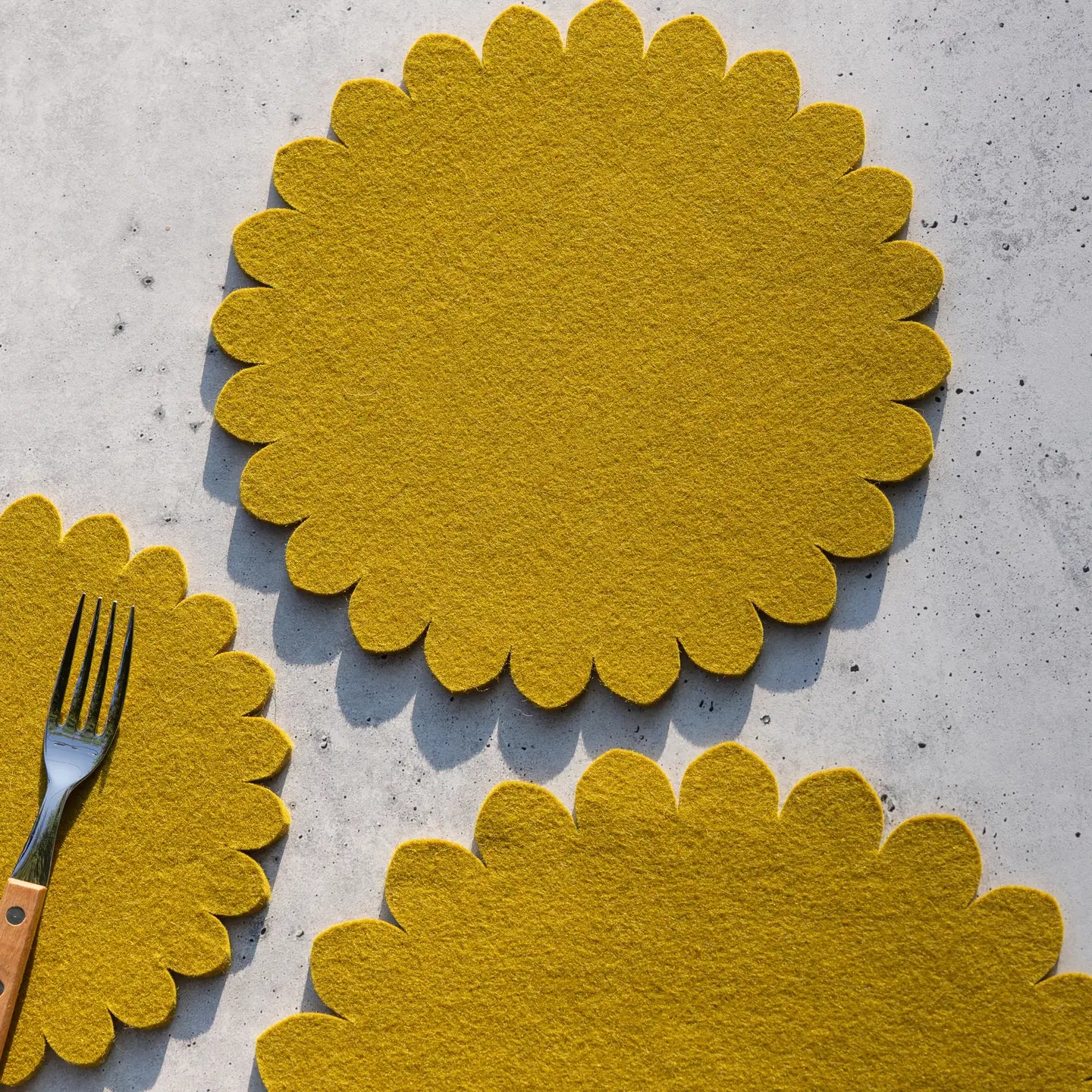 Crest Merino Wool 10" Trivet featuring traditional Japanese floral crest patterns, showcasing sustainable and luxurious Merino wool for kitchen protection.