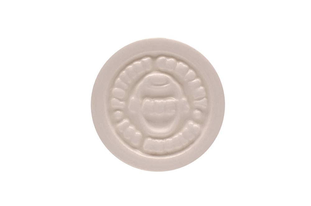 white ceramic stamp with Bauer Pottery Company