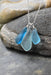 Elegant Blue Eco Glass Trio Sterling Silver Necklace showcasing three frosted glass drops, perfect for ocean enthusiasts, designed by Whitelotus Design.