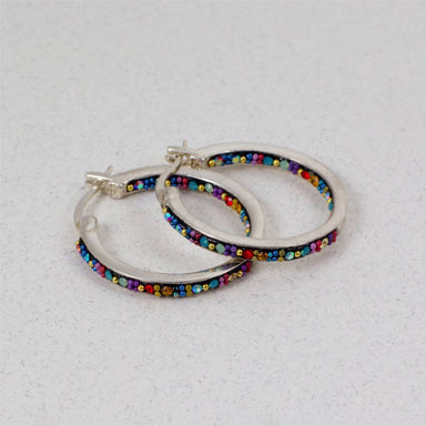 Extra large hoop earrings by Mosaico Jewels featuring sparkling crystals and silver design, perfect for adding elegance to any outfit.