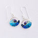 Mosaico Jewels Free Wave Earrings featuring a stunning crystal and silver design, symbolizing strength and beauty.
