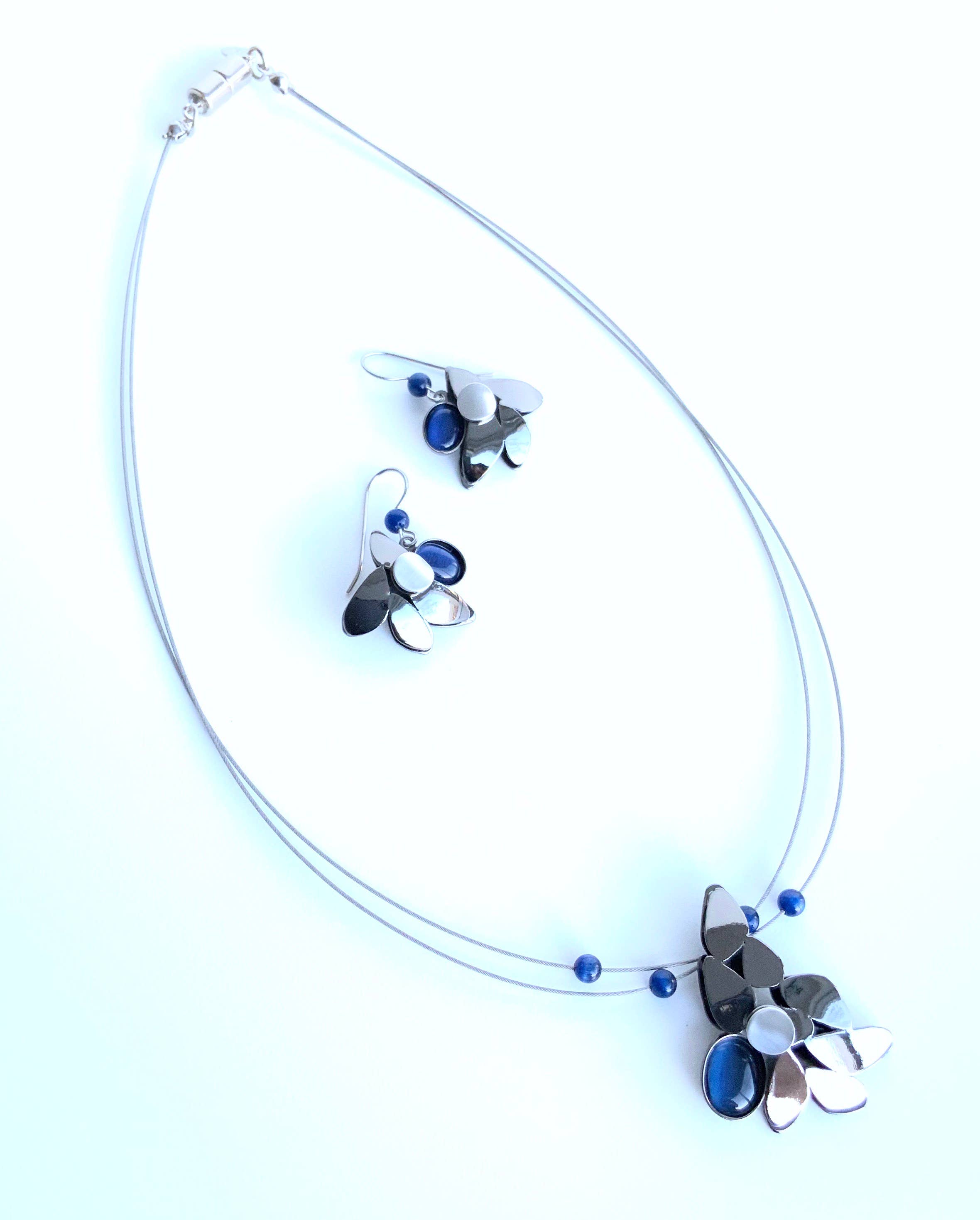 wire necklaces and earrings featuring purple beads and acrylic gemstones