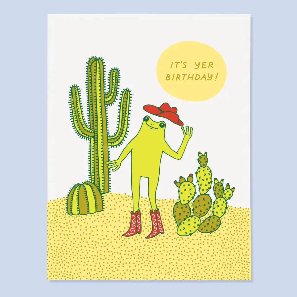 Colorful illustration of a quirky character with a green body and red cowboy hat, surrounded by cacti, celebrating a birthday. From The Good Twin Card Collection by The Good Twin.