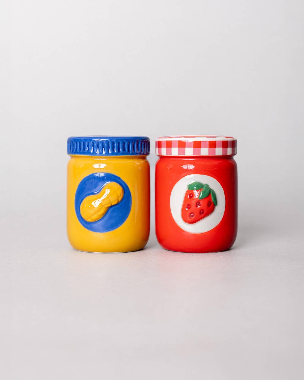 Two jars with colorful lids 