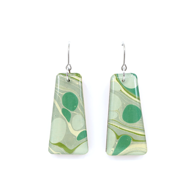 Stylish mid century modern green marble dangle earrings highlighting the distinctive pattern of UK marbled paper under UV-cured resin.