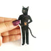 Black cat in sweater vinyl sticker