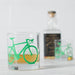 whiskey glass with green bicycle print