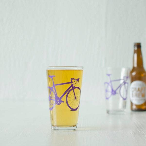 pint glass with purple bike