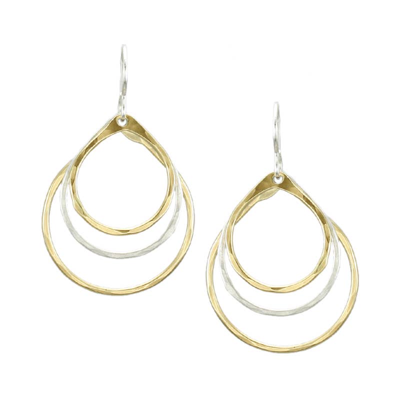 Tiered Teardrop Earring by Marjorie Baer showcasing three hammered teardrop rings in brass and silver. Delicate and elegant design with graceful movement, perfect for easy wear.