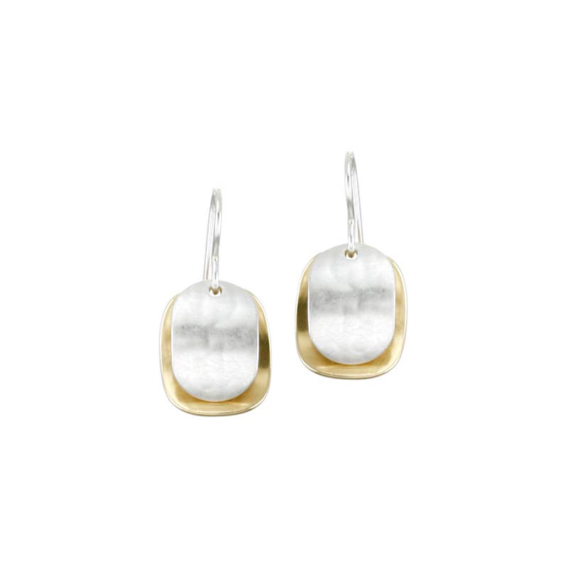 Layered Ovals Earring by Marjorie Baer featuring compact, sculptural design with two concave ovals in contrasting sizes, displaying a lightly hammered finish in brass and silver, measuring 0.5 inches wide by 0.6 inches long.