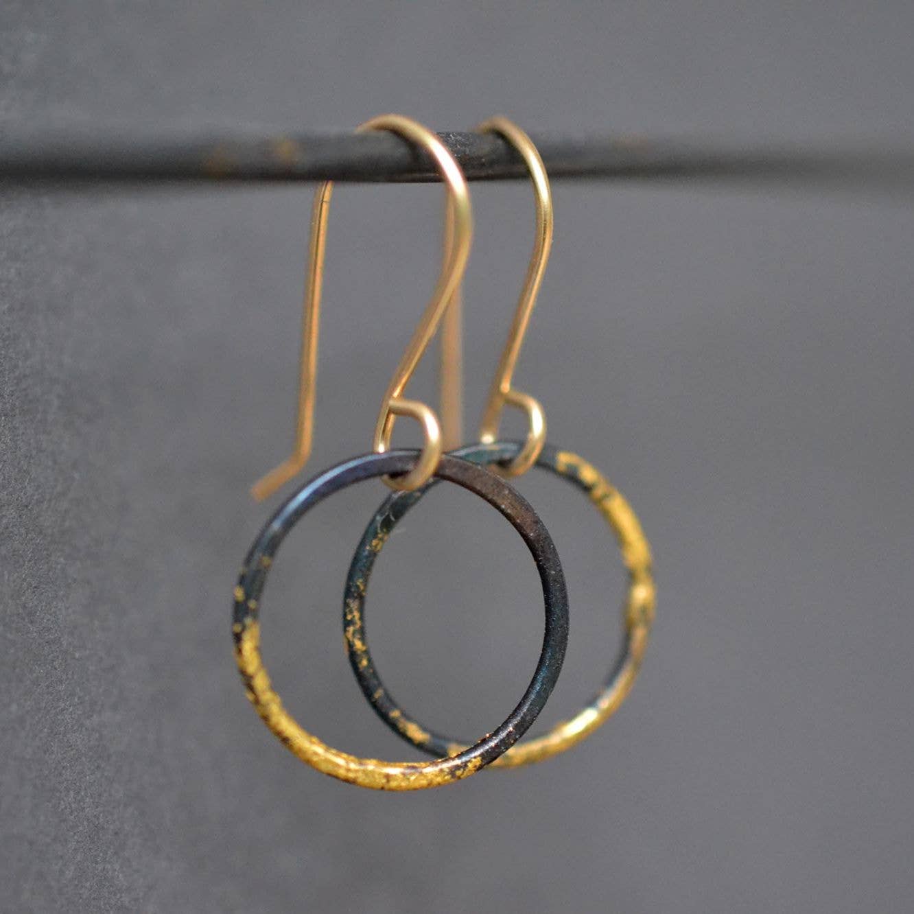 Small Steel and Gold Hoops: industrial chic with a sprinkle of sparkle, perfect for those who want to dazzle without the heavy metal vibe!