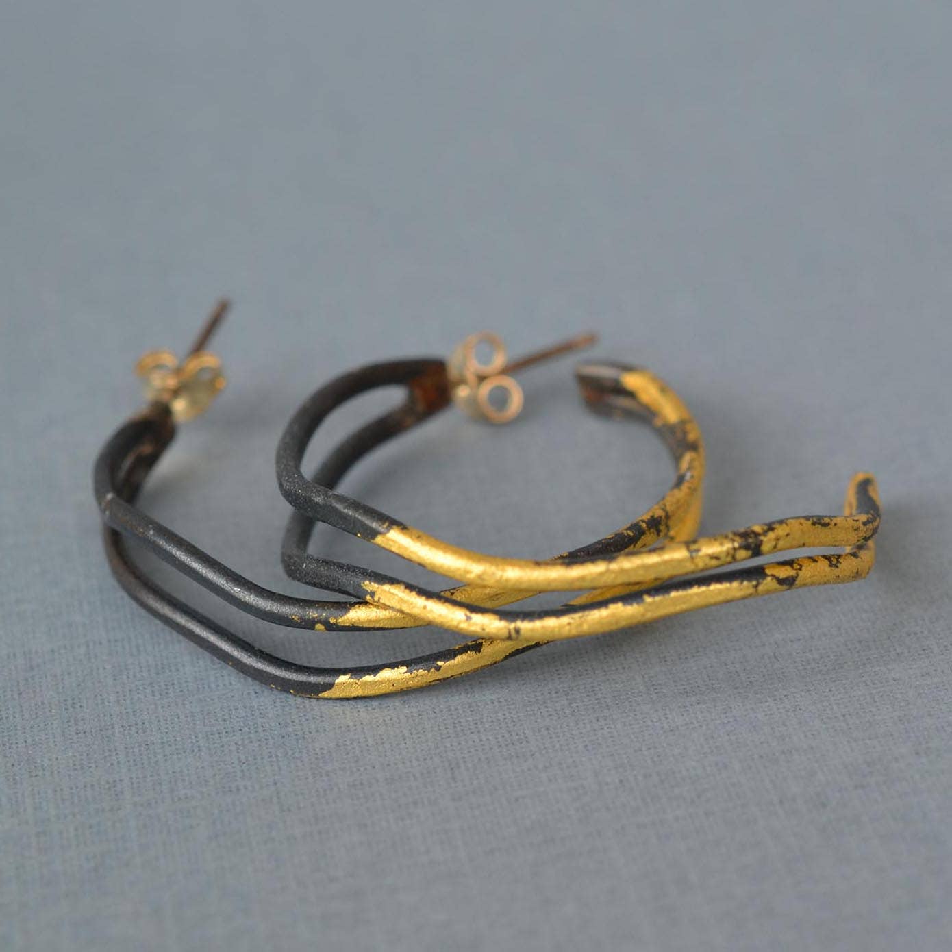 Small Wavey Steel & Gold Hoops: Now with extra pizzazz and a hint of sparkle! Who knew steel could look this glamorous?