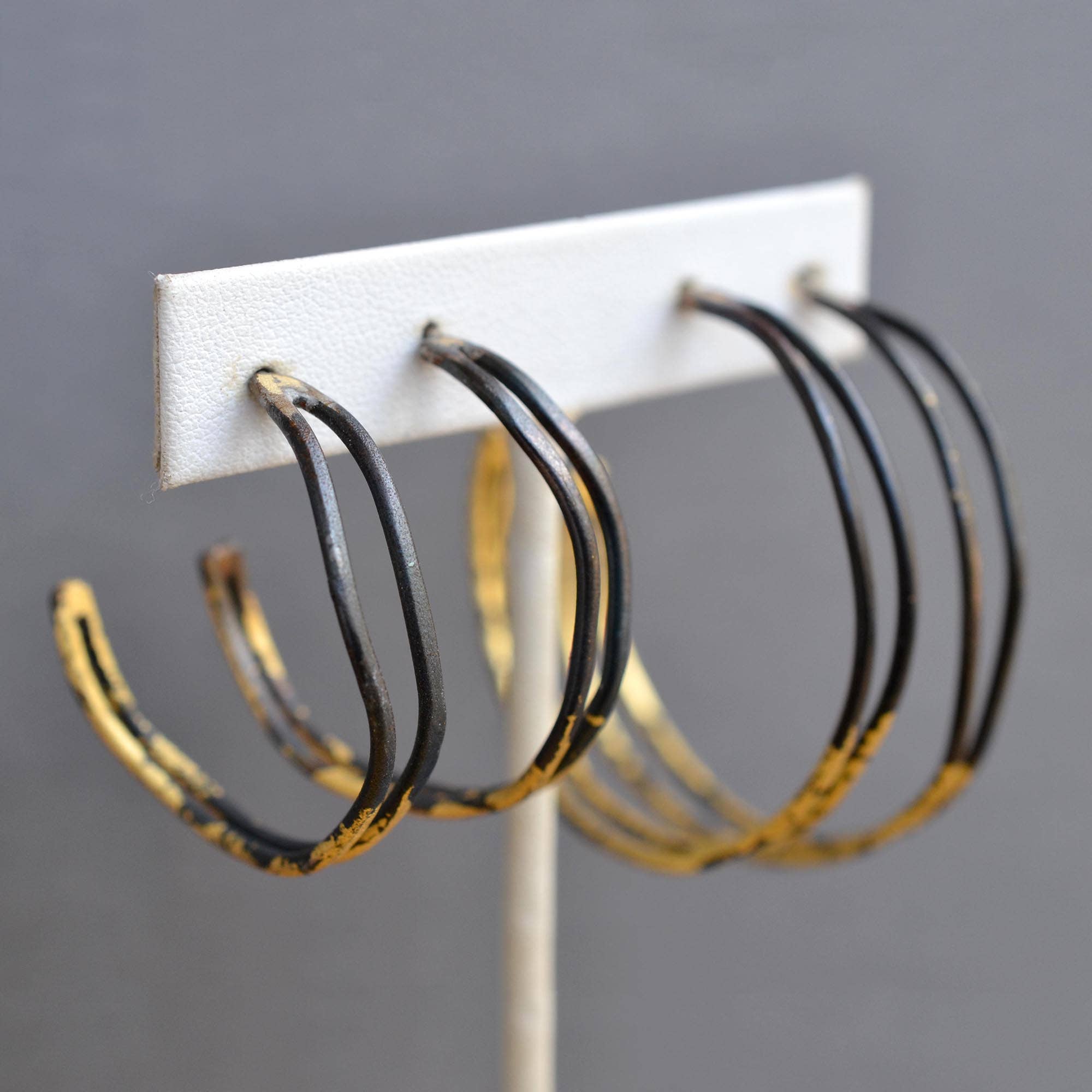 Behold the Small Wavey Steel & Gold Hoops, the perfect accessory to convince everyone you have your life together – at least in the jewelry department!