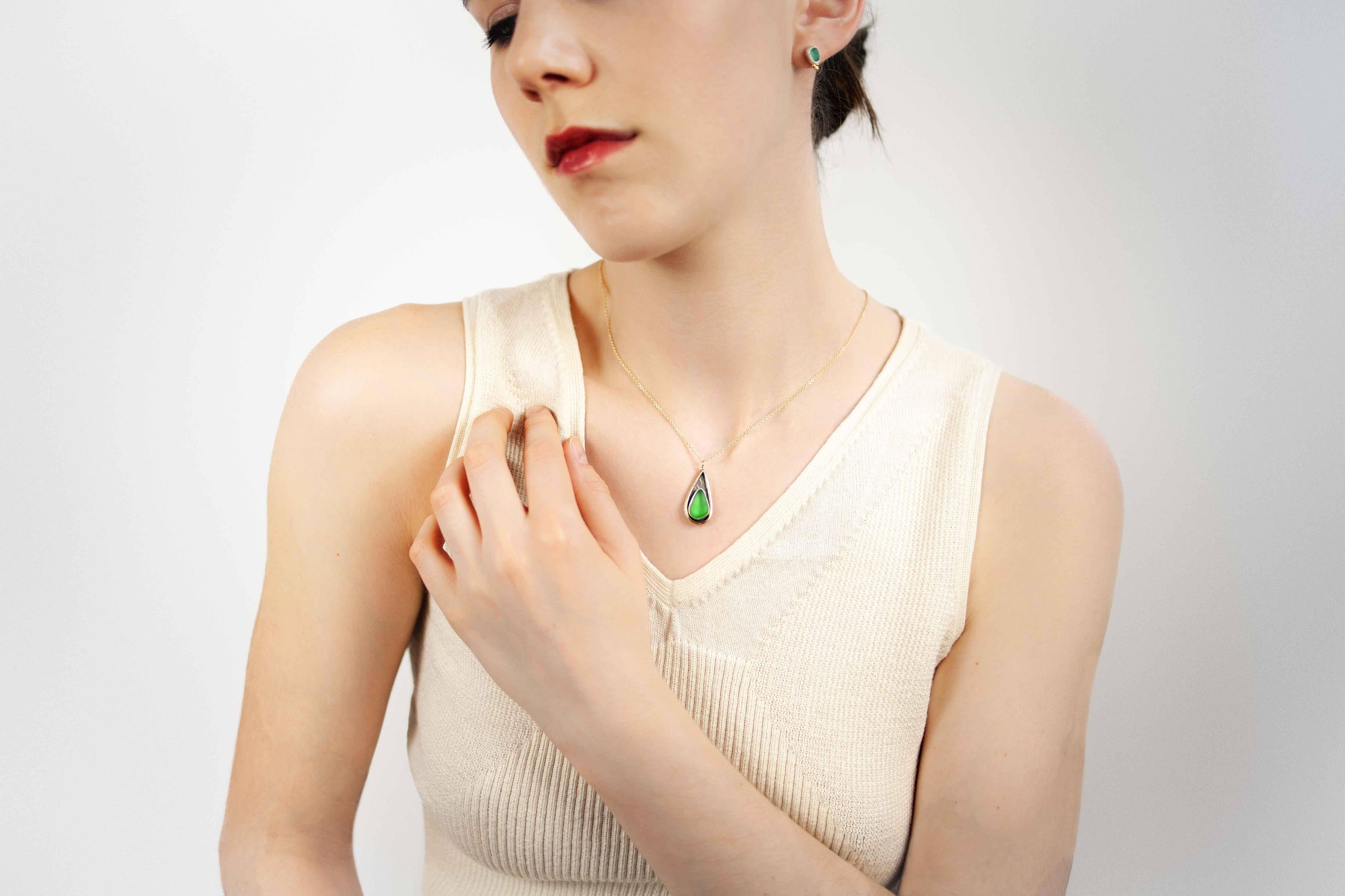 Close-up of the Mermaid Tear Necklace showing the natural sea glass and sterling silver craftsmanship.