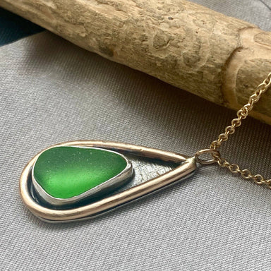 Mermaid Tear Necklace featuring authentic sea glass pendant and handcrafted sterling silver bezel, accented with 14k gold fill.