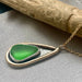 Mermaid Tear Necklace featuring authentic sea glass pendant and handcrafted sterling silver bezel, accented with 14k gold fill.