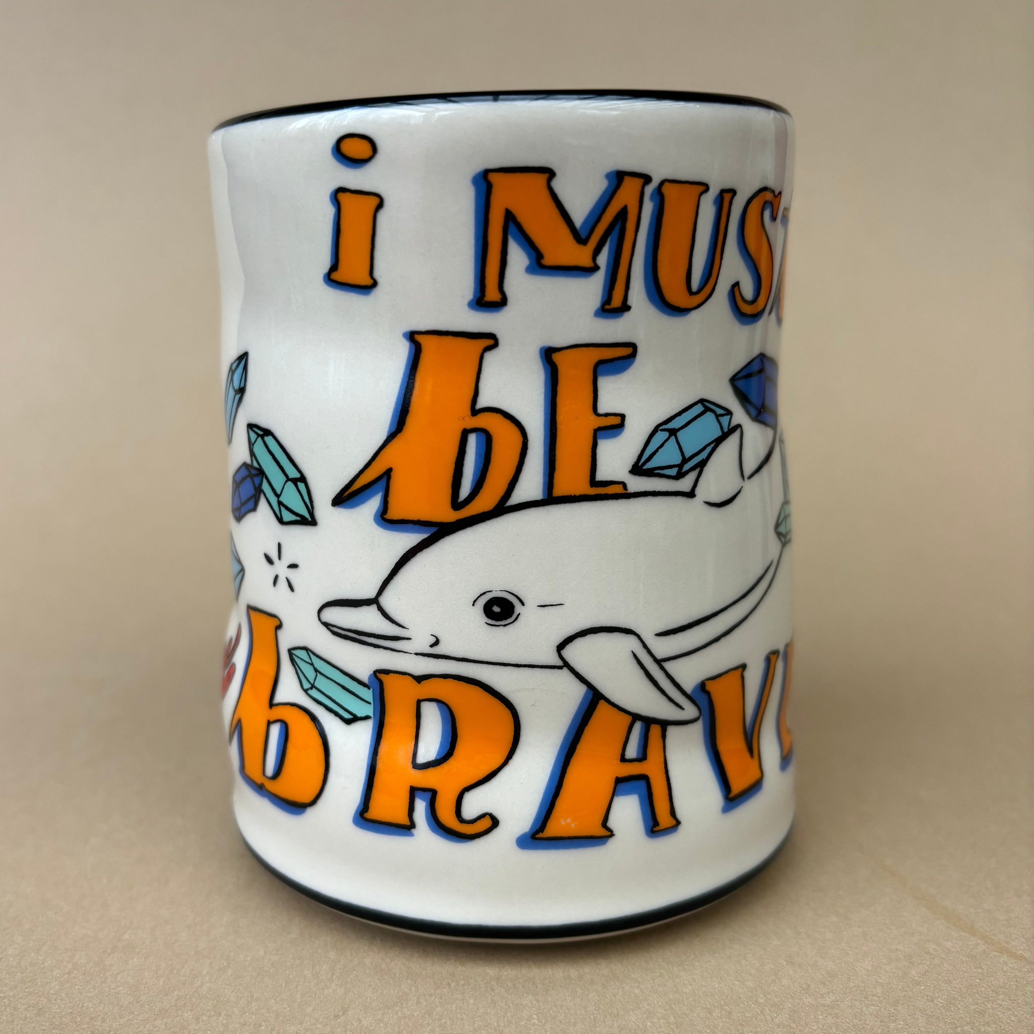 XLarge Lucky Sea Turtle Cup by The Bowl Maker featuring an artistic design of a dolphin alongside turquoise crystals and the phrase 'I must be brave'.