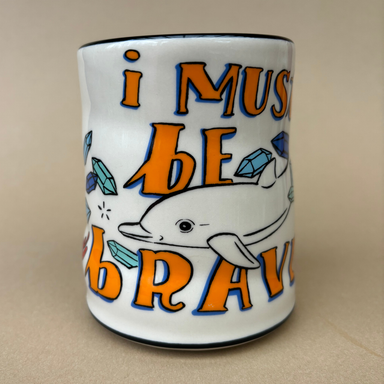 XLarge Lucky Sea Turtle Cup by The Bowl Maker featuring an artistic design of a dolphin alongside turquoise crystals and the phrase 'I must be brave'.