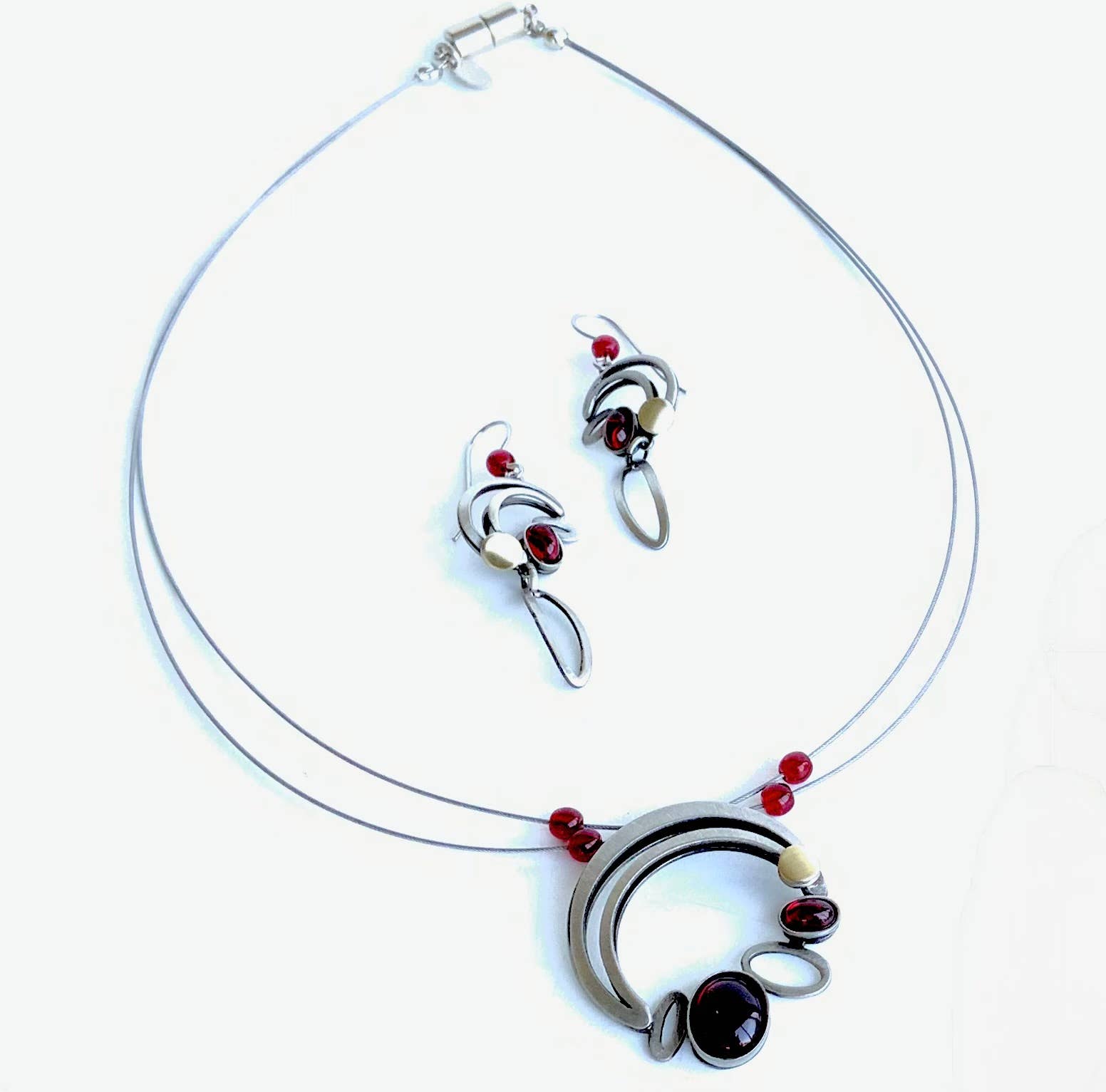 wire necklaces and earrings featuring red beads and acrylic gemstones
