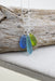Eco Glass Trio Sterling Silver Necklace featuring three smooth frosted Eco Glass drops in vibrant ocean colors, elegantly crafted for coastal chic style.