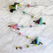 Colorful felt bird garland featuring delightful 3D needle felted birds like robins and woodpeckers, perfect for adding flair and a touch of whimsy to your decor.