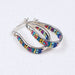 Crystal & Silver Small Hoop Earrings capturing light with delicate inlaid crystals for a shimmering effect.