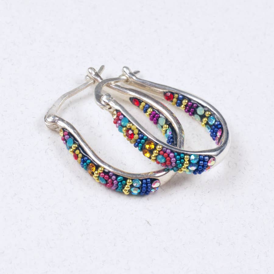 Crystal & Silver Small Hoop Earrings capturing light with delicate inlaid crystals for a shimmering effect.