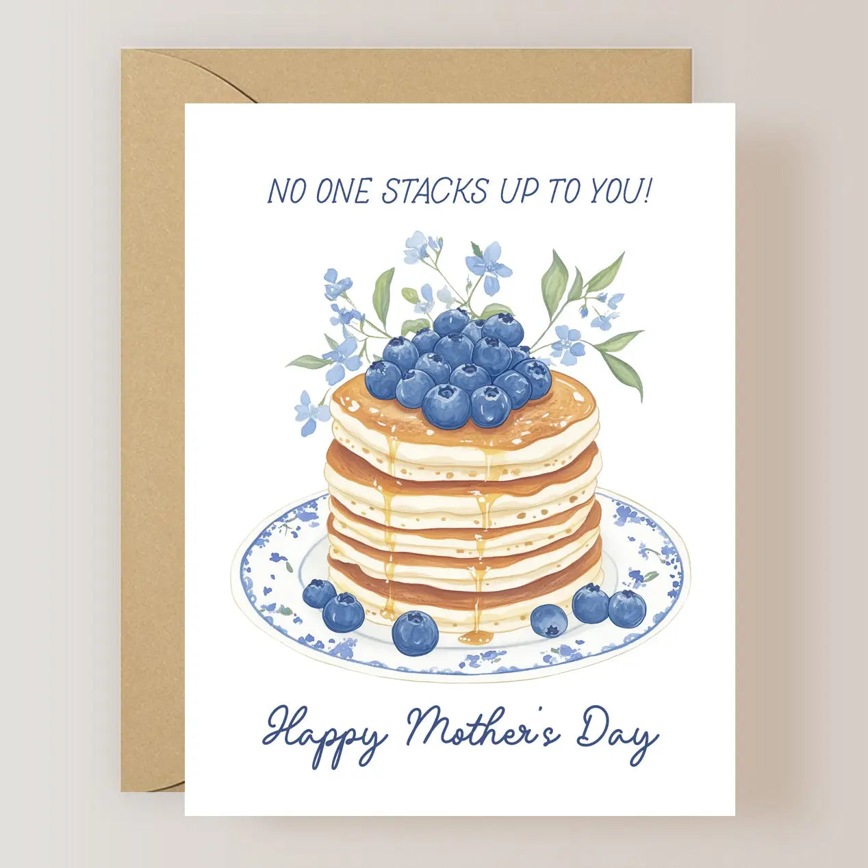 Mother's Day Card Collection depicting a stack of pancakes topped with blueberries and the phrase 'NO ONE STACKS UP TO YOU! Happy Mother's Day' by ARTISANS & agency.