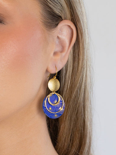 Close-up of Atlas Earrings showing intricate constellation artwork and niobium sphere, ready for your next interstellar adventure!