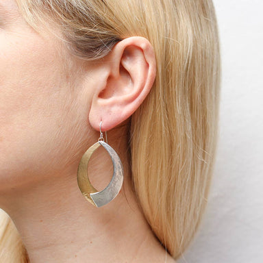 Large Overlap Swoops Wire Earring by Marjorie Baer featuring bold two-tone design in brass and silver, with a hammered finish, measuring 1.25 inches wide by 1.8 inches tall.