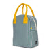 Green and white striped lunch bag with yellow handles 