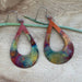 A model wearing the Boho Large Open Teardrop Fire Painted Copper Earrings, demonstrating their lightweight style and beauty.
