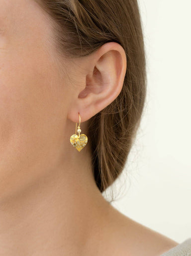 Budding Heart Earrings showcased with style - handcrafted by Holly Yashi, these earrings are the perfect mix of poetry and playfulness, complete with gold fill and niobium!