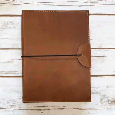 brown leather journal with elastic string