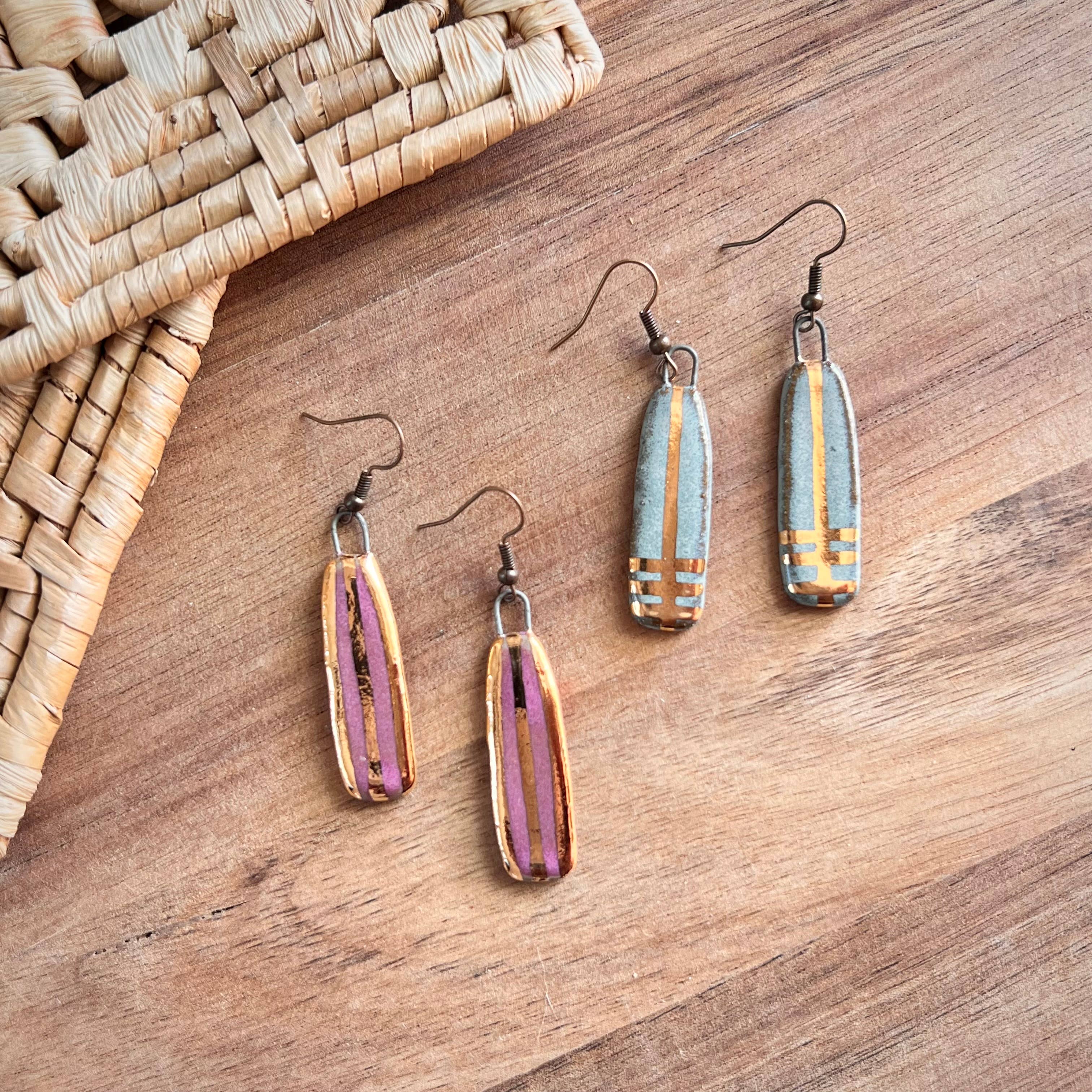 Handmade turquoise long line designed earrings featuring a unique ceramic texture, highlighted with 24K gold paint, by The Artifact House.