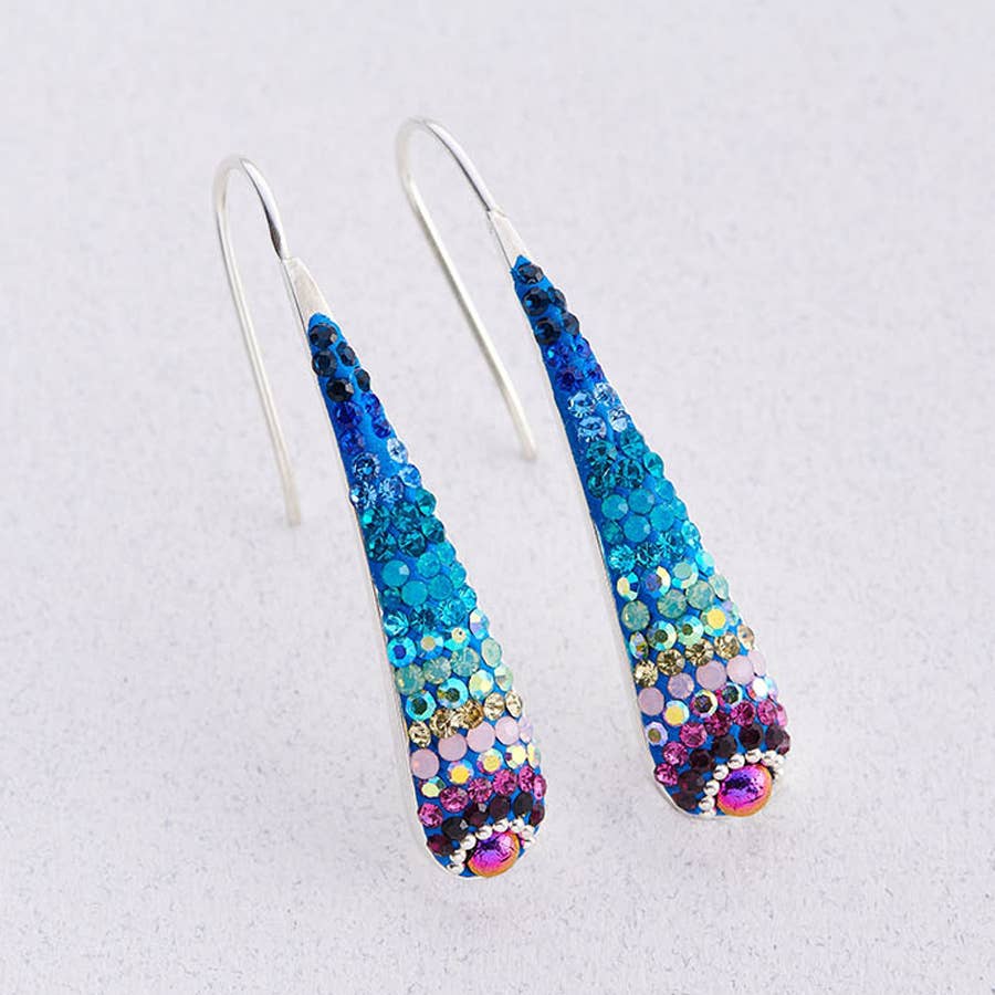 Stylish Crystal & Silver Drop Earrings showcased with a shimmering convex design for elegant fashion.